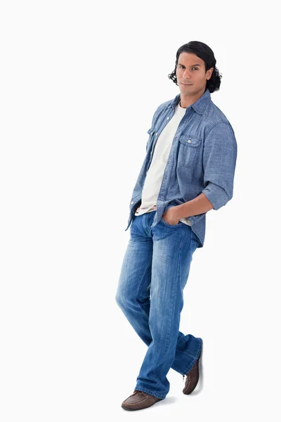 Man leaning against a wall — Stock Photo, Image