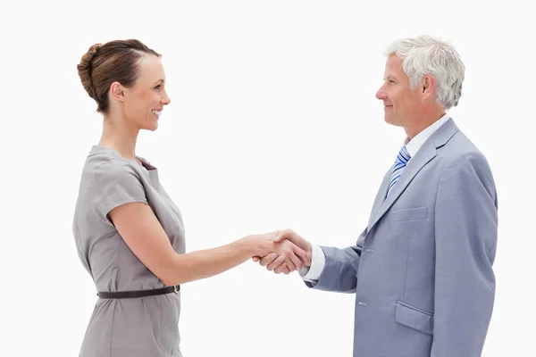 Close-up of a white hair man face to face and shaking hands with — Stock Photo, Image