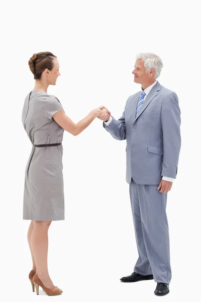 White hair businessman smiling face to face and shaking hands wi — Stock Photo, Image