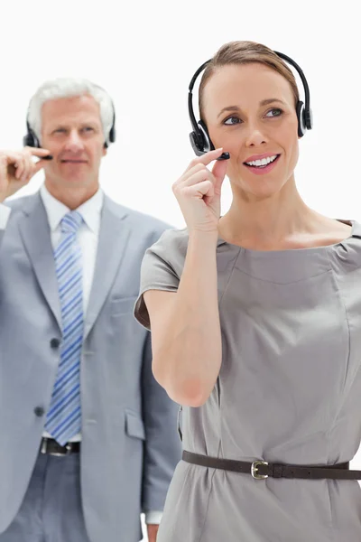 Close-up of a woman wearing a headset with a white hair business — Stock Photo, Image