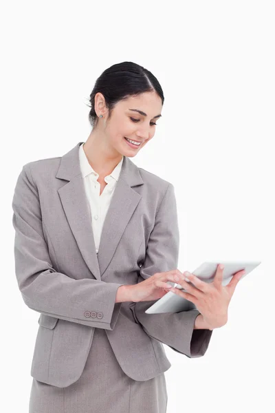 Smiling saleswoman using her tablet computer — Stock Photo, Image