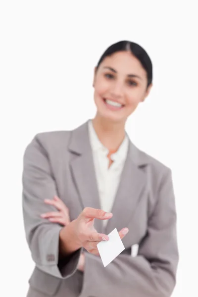 Business card being handed over by smiling saleswoman — Stock Photo, Image