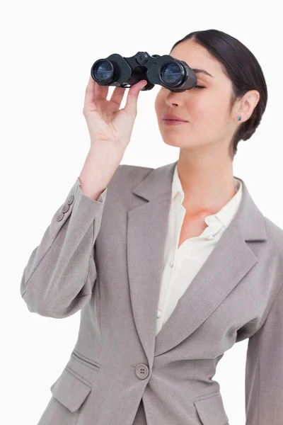 Businesswoman looking through spy glasses — Stock Photo, Image