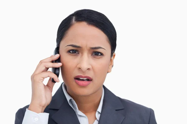 Close up of saleswoman getting bad news from caller — Stock Photo, Image