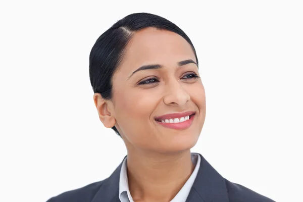 Close up de vendedora sorrindo olhando para o lado — Fotografia de Stock