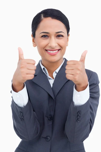 Close up de vendedora sorrindo dando polegares para cima — Fotografia de Stock