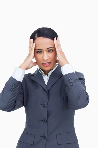Close up of saleswoman experiencing a headache — Stock Photo, Image