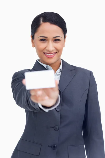 Close up of smiling saleswoman showing her business card — Stock Photo, Image