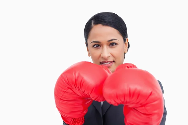 Close up of confident saleswoman with boxing gloves — Stock Photo, Image
