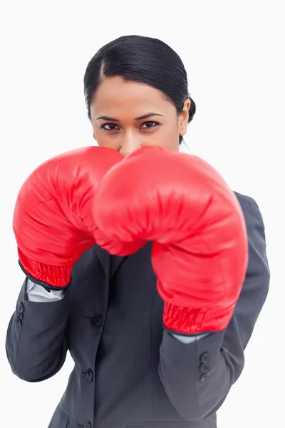 Close up of belligerent saleswoman with boxing gloves — Stock Photo, Image