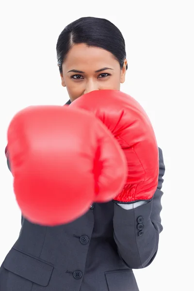 Close up of saleswoman with boxing gloves attacking — Stock Photo, Image