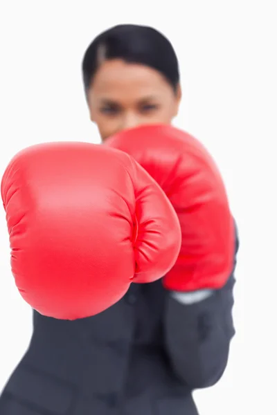 Close up of saleswoman with boxing gloves attacking — Stock Photo, Image