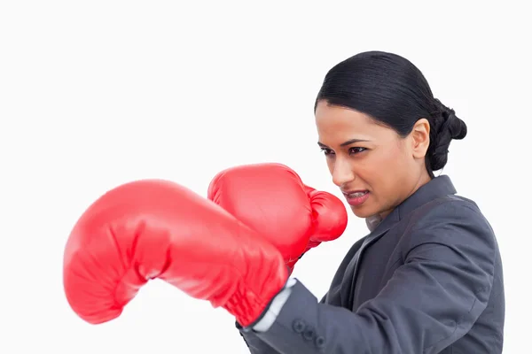 Close up side view of aggressive saleswoman with boxing gloves — Stock Photo, Image