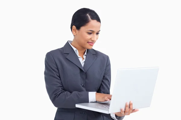 Close up of saleswoman using her laptop — Stock Photo, Image