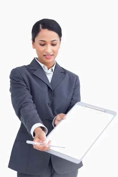 Close up of saleswoman asking for signature — Stock Photo, Image
