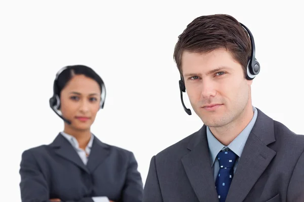 Close up of serious looking call center agents — Stock Photo, Image