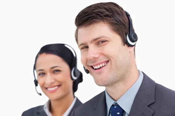 Detailní záběr úsměvem call center zaměstnanci — Stock fotografie