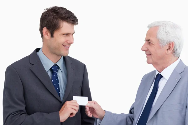 Close up of businessmen exchanging business card — Stock Photo, Image