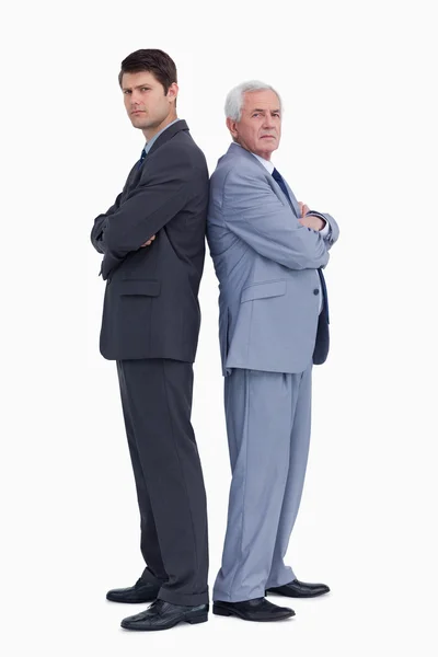 Businessmen standing back to back — Stock Photo, Image