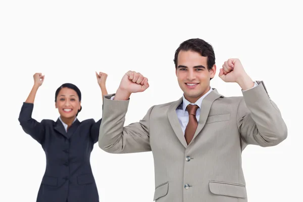 Cheering salesman with colleague behind him — Stock Photo, Image