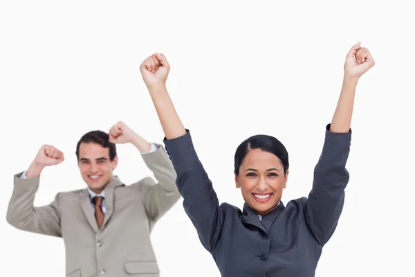 Cheering saleswoman with colleague behind her — Stock Photo, Image