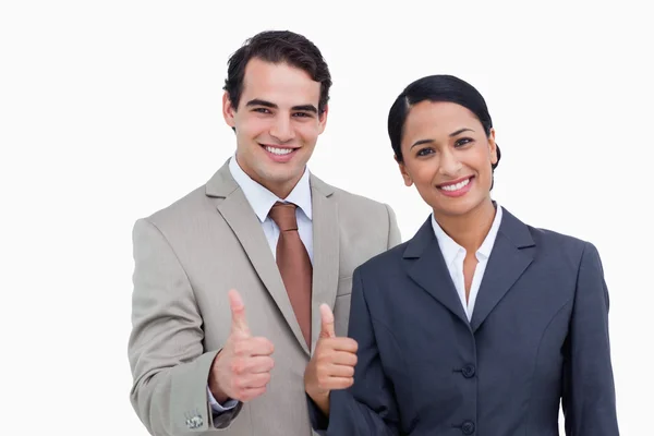 Smiling salesteam giving approval — Stock Photo, Image
