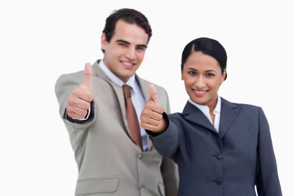 Smiling salesteam giving their approval — Stock Photo, Image
