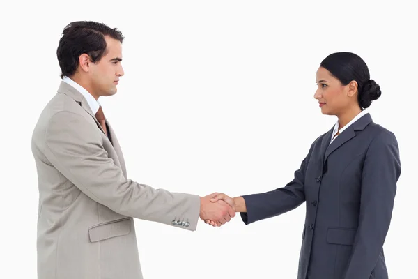Side view of serious business partners shaking hands — Stock Photo, Image