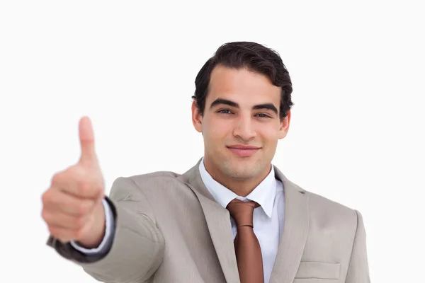 Close up de jovem vendedor dando polegar para cima — Fotografia de Stock