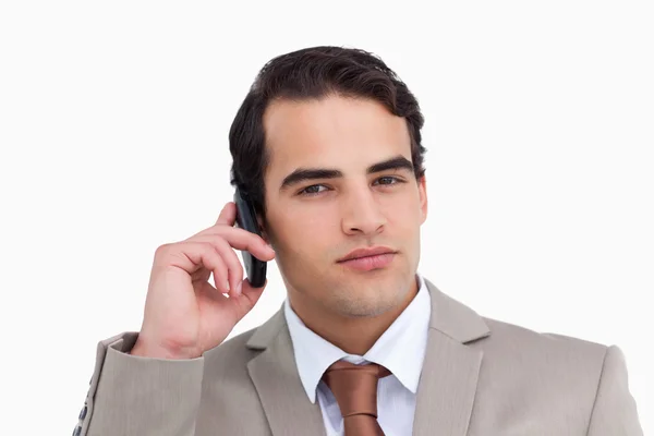Close up of serious salesman on his mobile phone — Stock Photo, Image