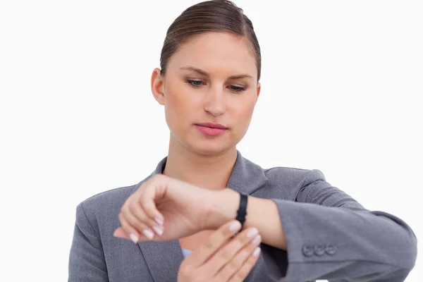 Businesswoman checking her watch — Stock Photo, Image