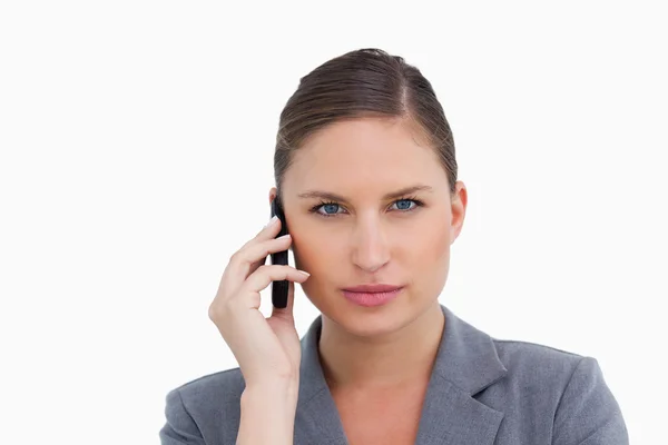 Close up of tradeswoman listening to caller — Stock Photo, Image