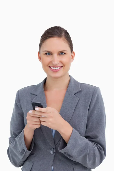 Close up of smiling tradeswoman holding cellphone — Stock Photo, Image