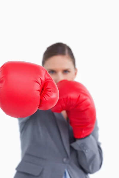 Attacking fist of tradeswoman in boxing glove — Stock Photo, Image