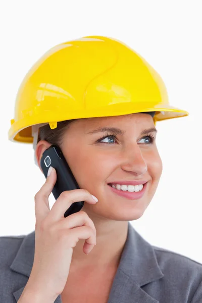 Close up of female architect with cellphone and helmet on — Stock Photo, Image