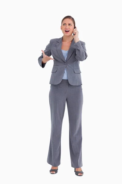 Angry tradeswoman yelling at caller — Stock Photo, Image