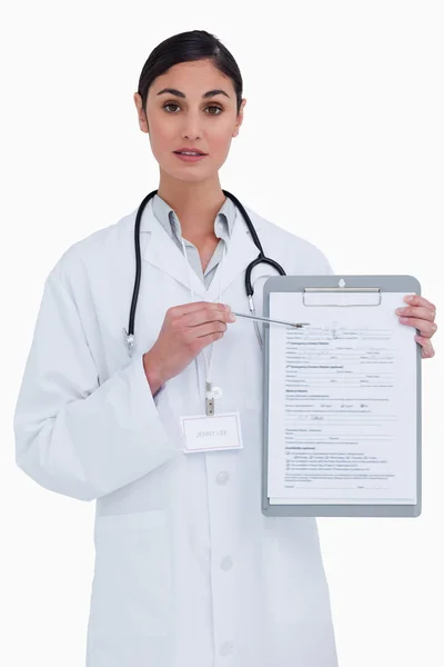 Female doctor pointing at form — Stock Photo, Image