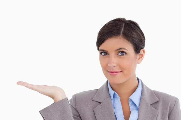 Close up of female entrepreneur presenting with palm up — Stock Photo, Image