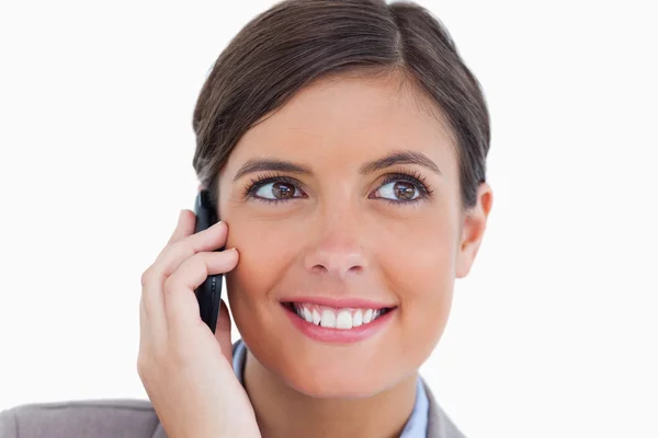 Close up of smiling female entrepreneur on her cellphone — Stock Photo, Image