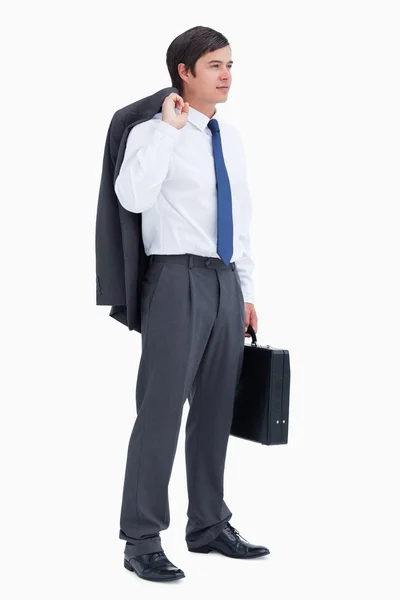 Vista lateral do comerciante com mala e jaqueta — Fotografia de Stock