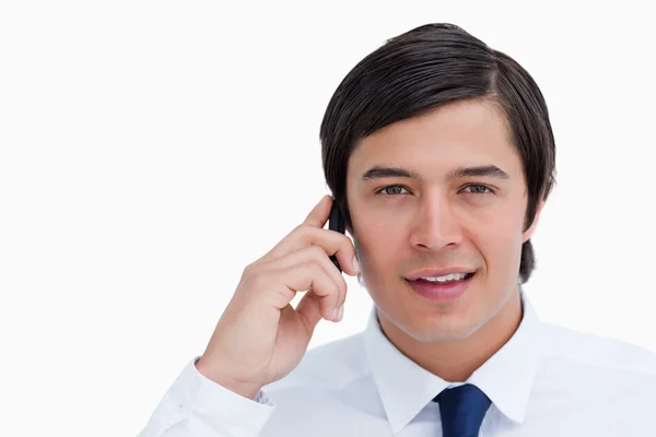 Close up of tradesman talking on his cellphone — Stock Photo, Image