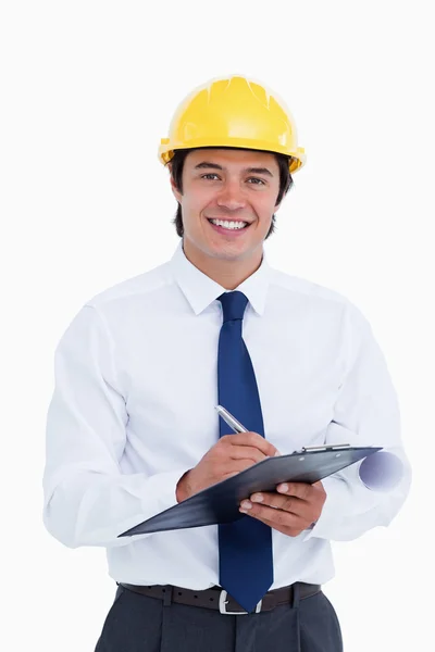 Smiling male architect with clipboard and pen — Stock Photo, Image