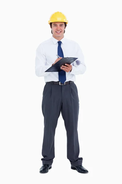 Smiling male architect with pen and clipboard — Stock Photo, Image