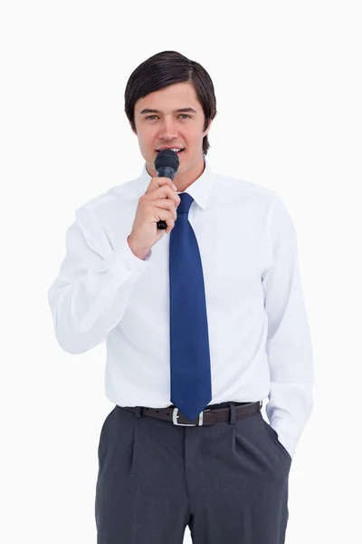 Young tradesman talking with microphone — Stock Photo, Image