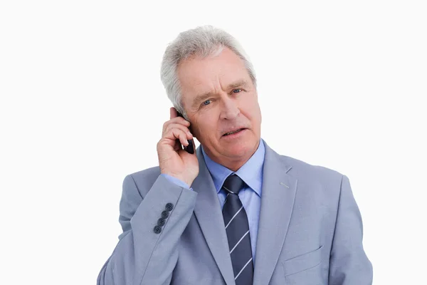 Close up of mature tradesman on his mobile phone — Stock Photo, Image