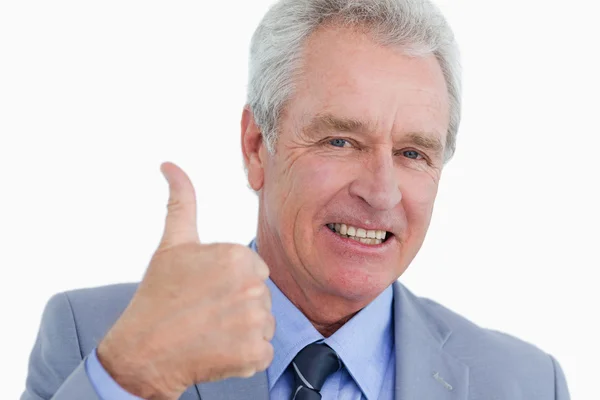 Close up of smiling mature tradesman giving thumb up — Stock Photo, Image