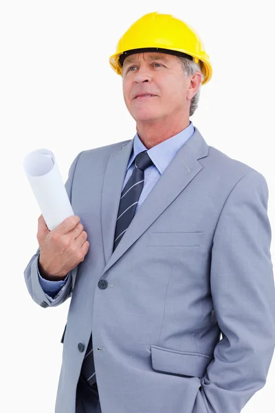 Mature architect wearing helmet and holding plans — Stock Photo, Image
