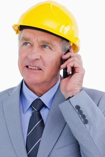 Close up of mature architect talking on the phone — Stock Photo, Image