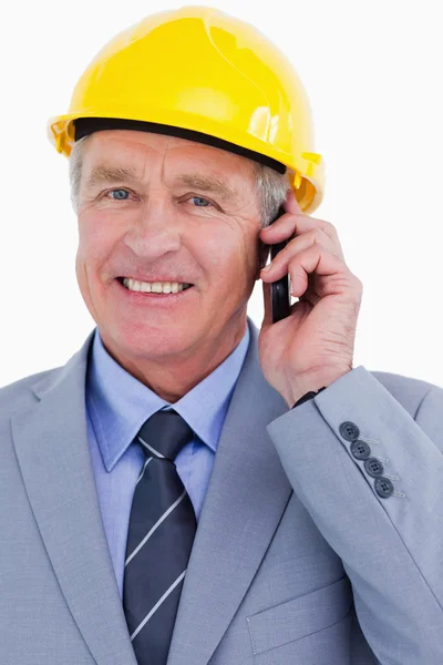Close up of smiling mature architect on his cellphone — Stock Photo, Image