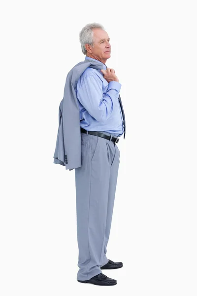 Zijaanzicht van volwassen handelaar met jas over zijn schouder — Stockfoto
